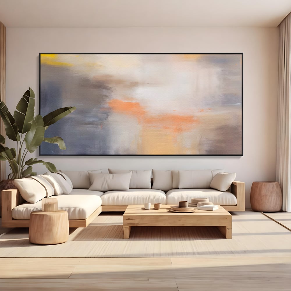 Tablou canvas cu pictura abstracta cu pete portocalii, in rama de aluminiu negru, pe perete intr-un living